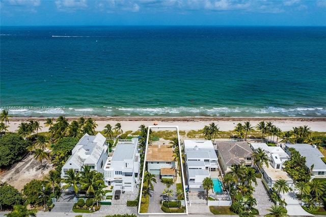 drone / aerial view featuring a view of the beach and a water view