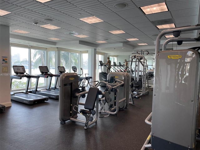 gym with a paneled ceiling