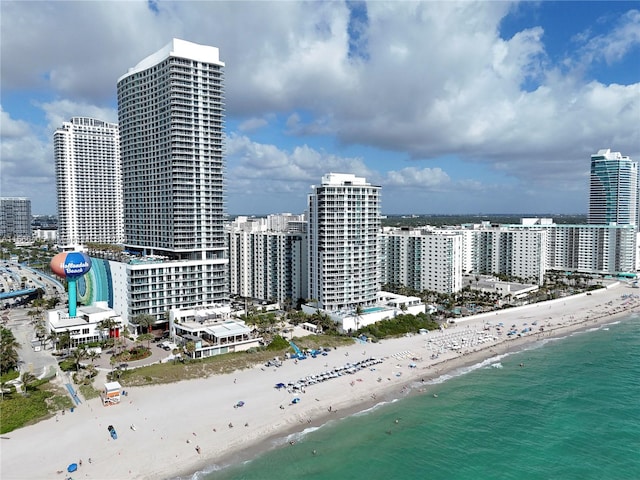 aerial view featuring a water view and a view of the beach