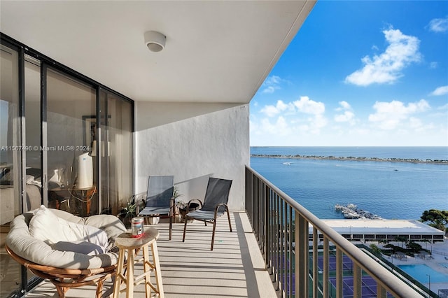 balcony featuring a water view