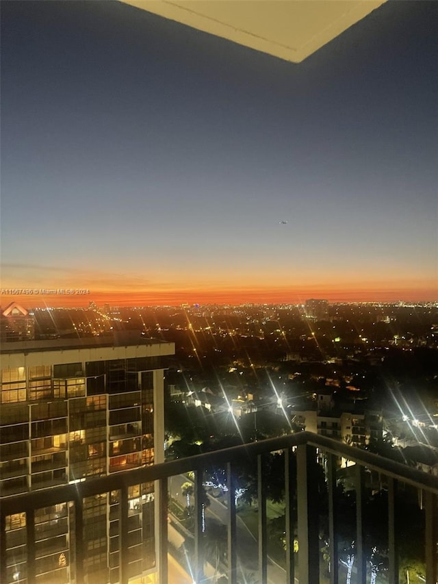 view of balcony at dusk