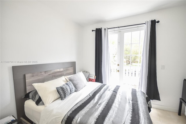 bedroom with access to exterior and french doors