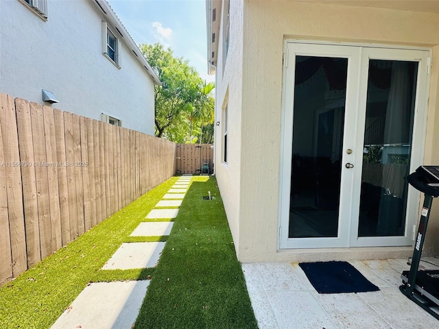 view of yard with french doors