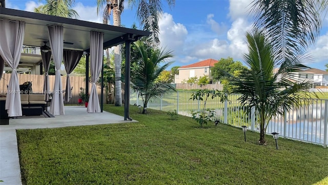 view of yard featuring a water view and a patio area