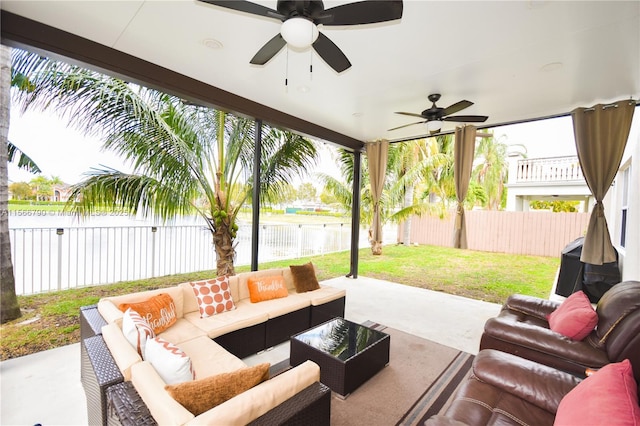 view of patio / terrace featuring an outdoor hangout area, ceiling fan, and a water view