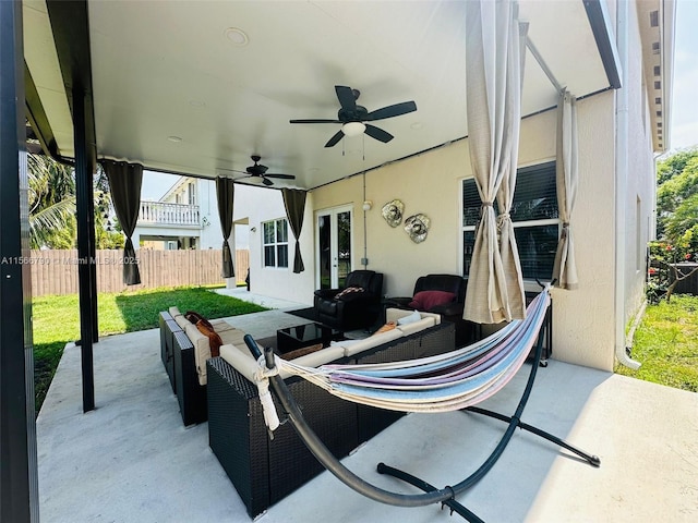 view of patio featuring an outdoor hangout area and ceiling fan