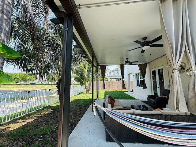 view of patio featuring french doors and ceiling fan