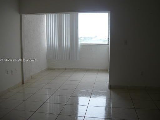 empty room featuring light tile floors