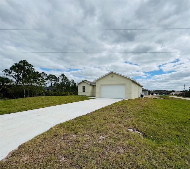 view of side of home with a lawn and a garage