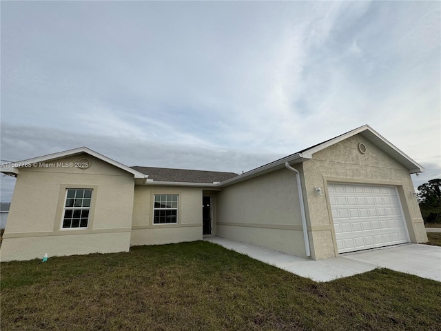 ranch-style home with a garage and a front yard