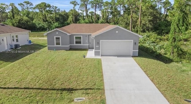 single story home with central AC unit, a garage, and a front yard