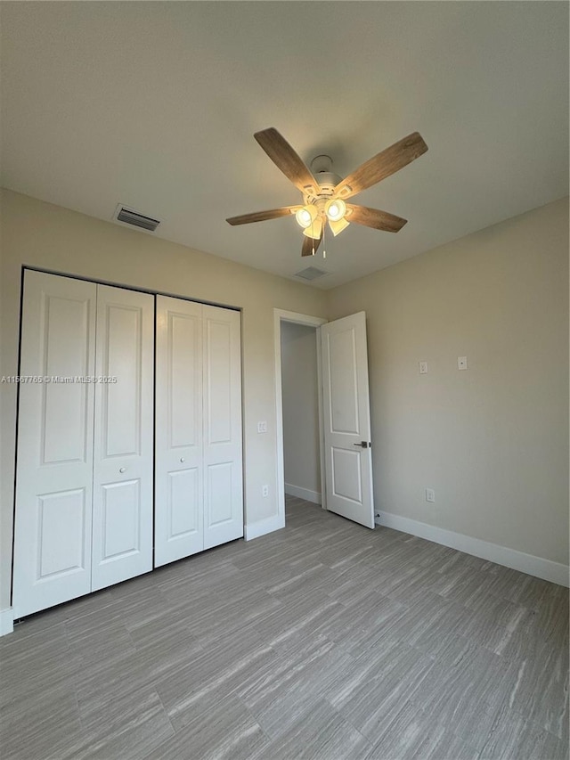 unfurnished bedroom featuring ceiling fan