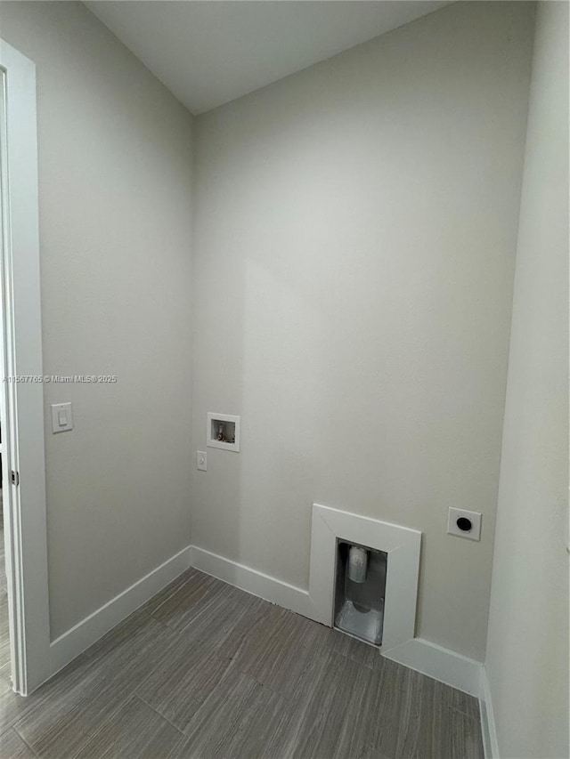 laundry room featuring hookup for a washing machine, dark hardwood / wood-style floors, and hookup for an electric dryer