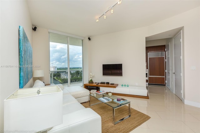 living room with light tile flooring, rail lighting, and expansive windows