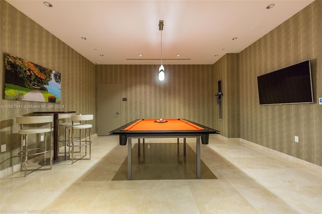 playroom featuring wood walls, pool table, and light tile floors