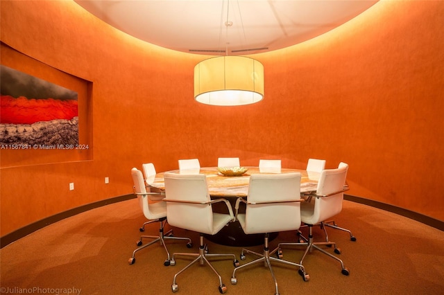 view of carpeted dining space