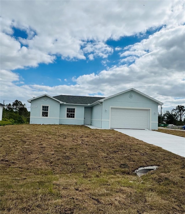 single story home featuring a front yard and a garage