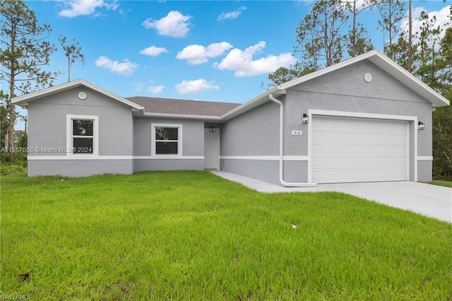 ranch-style home featuring a garage and a front yard