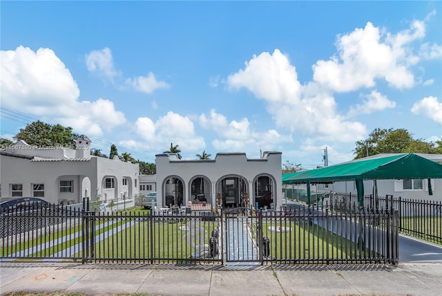 view of gate featuring a yard and fence