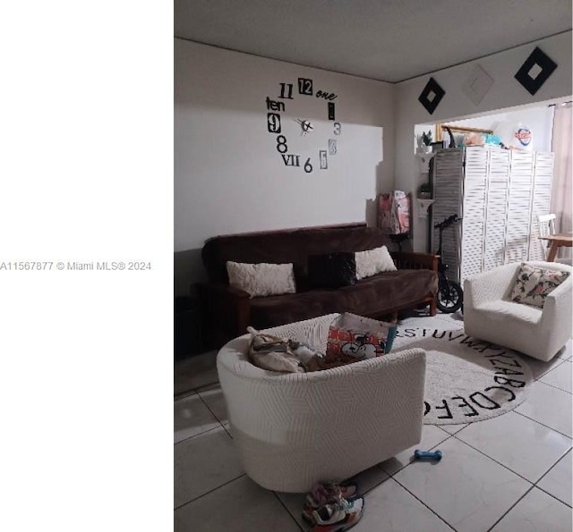 living room featuring light tile floors