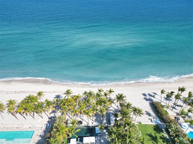 bird's eye view with a view of the beach and a water view