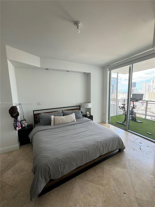 tiled bedroom featuring access to exterior