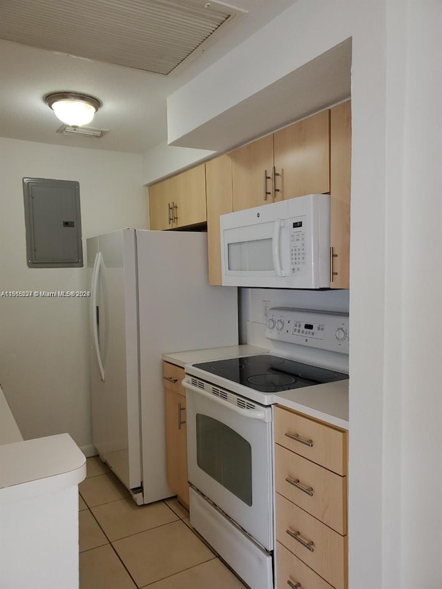 kitchen featuring white appliances, light tile flooring, and light brown cabinets