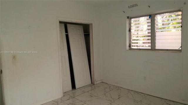 unfurnished bedroom featuring a closet