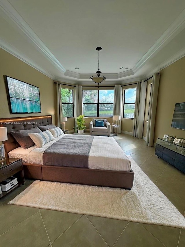 tiled bedroom with crown molding and a raised ceiling