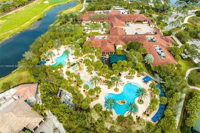 birds eye view of property with a water view