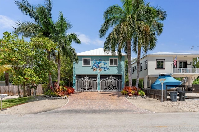 view of front of house featuring a carport and a balcony