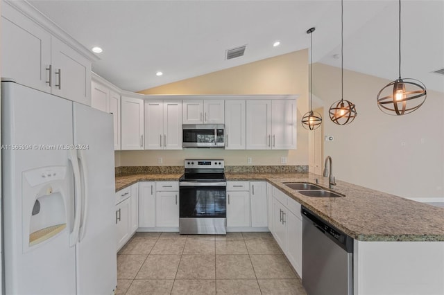 kitchen featuring sink, hanging light fixtures, stainless steel appliances, vaulted ceiling, and white cabinets