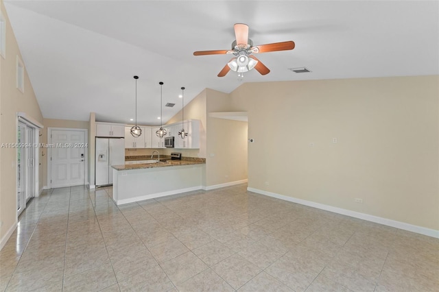 unfurnished living room with ceiling fan, light tile patterned floors, sink, and vaulted ceiling