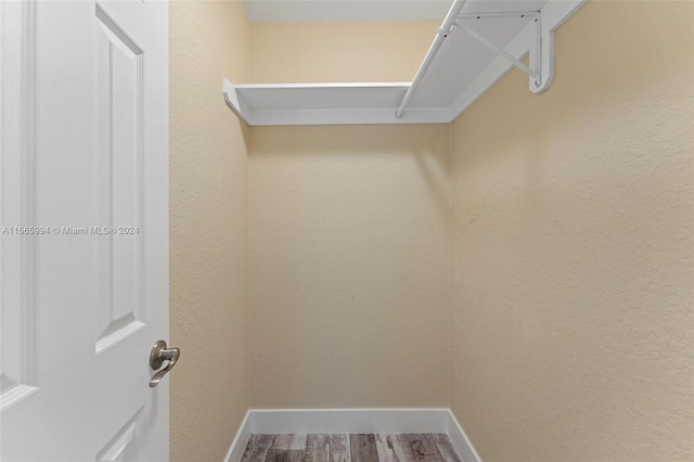 walk in closet featuring hardwood / wood-style floors