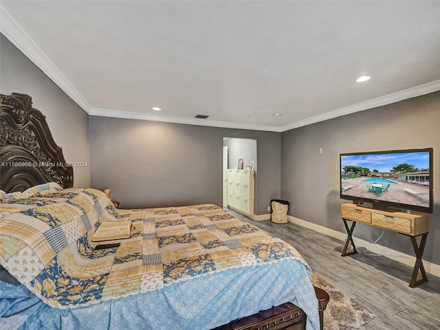 bedroom featuring ornamental molding and wood-type flooring