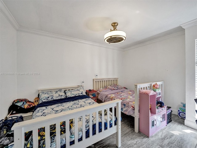 bedroom featuring crown molding and light tile floors