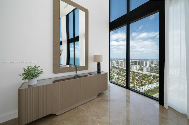 interior space with plenty of natural light and light tile flooring