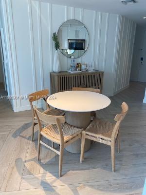 sitting room with light hardwood / wood-style floors and radiator