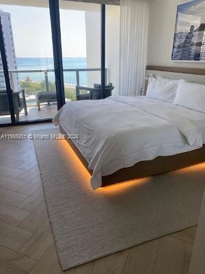 bedroom featuring expansive windows