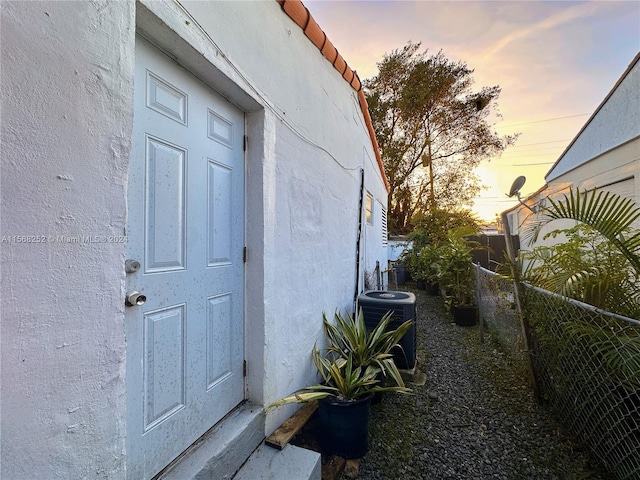 property exterior at dusk with central AC