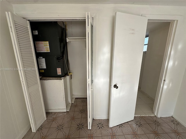 interior space with a closet and light tile floors