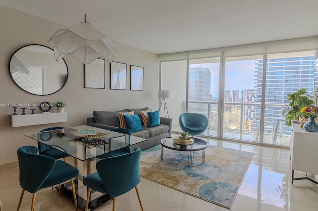 living room with light tile patterned floors and floor to ceiling windows