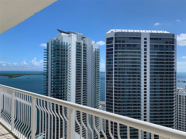 balcony featuring a water view