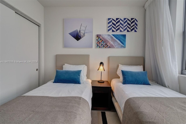 carpeted bedroom featuring a closet