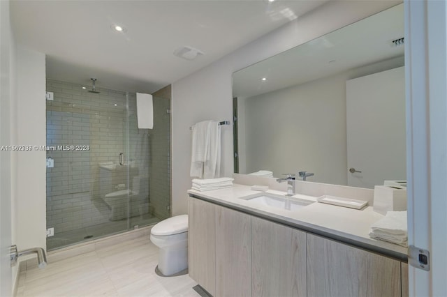 bathroom with walk in shower, oversized vanity, toilet, and tile flooring