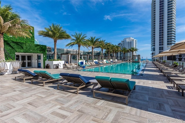 view of swimming pool with a patio