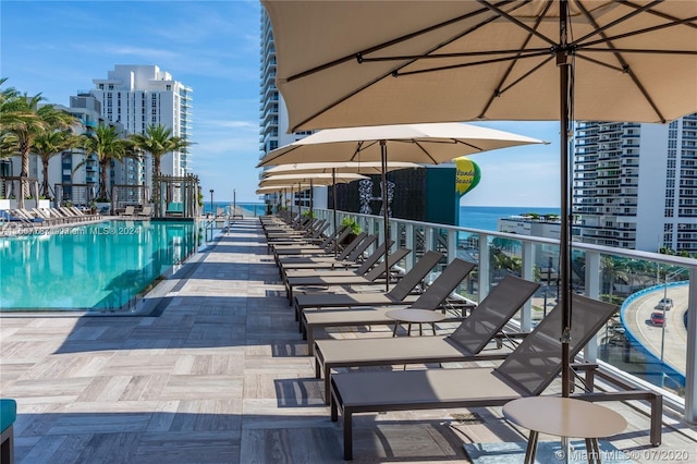 view of pool featuring a water view