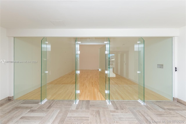 unfurnished bedroom with a closet and light wood-type flooring