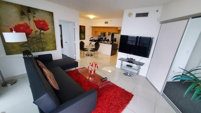 living room with light tile flooring