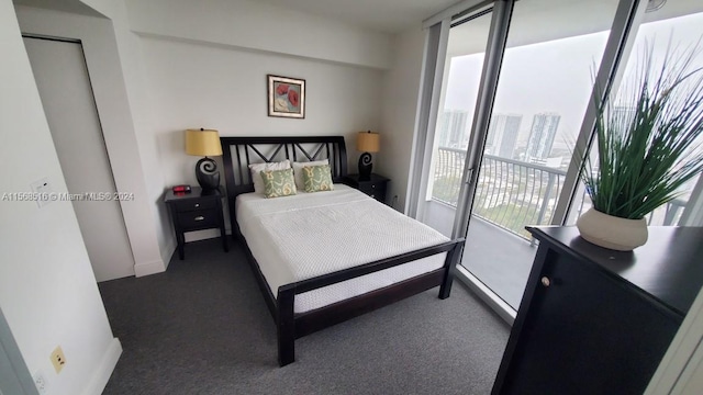 bedroom with dark colored carpet